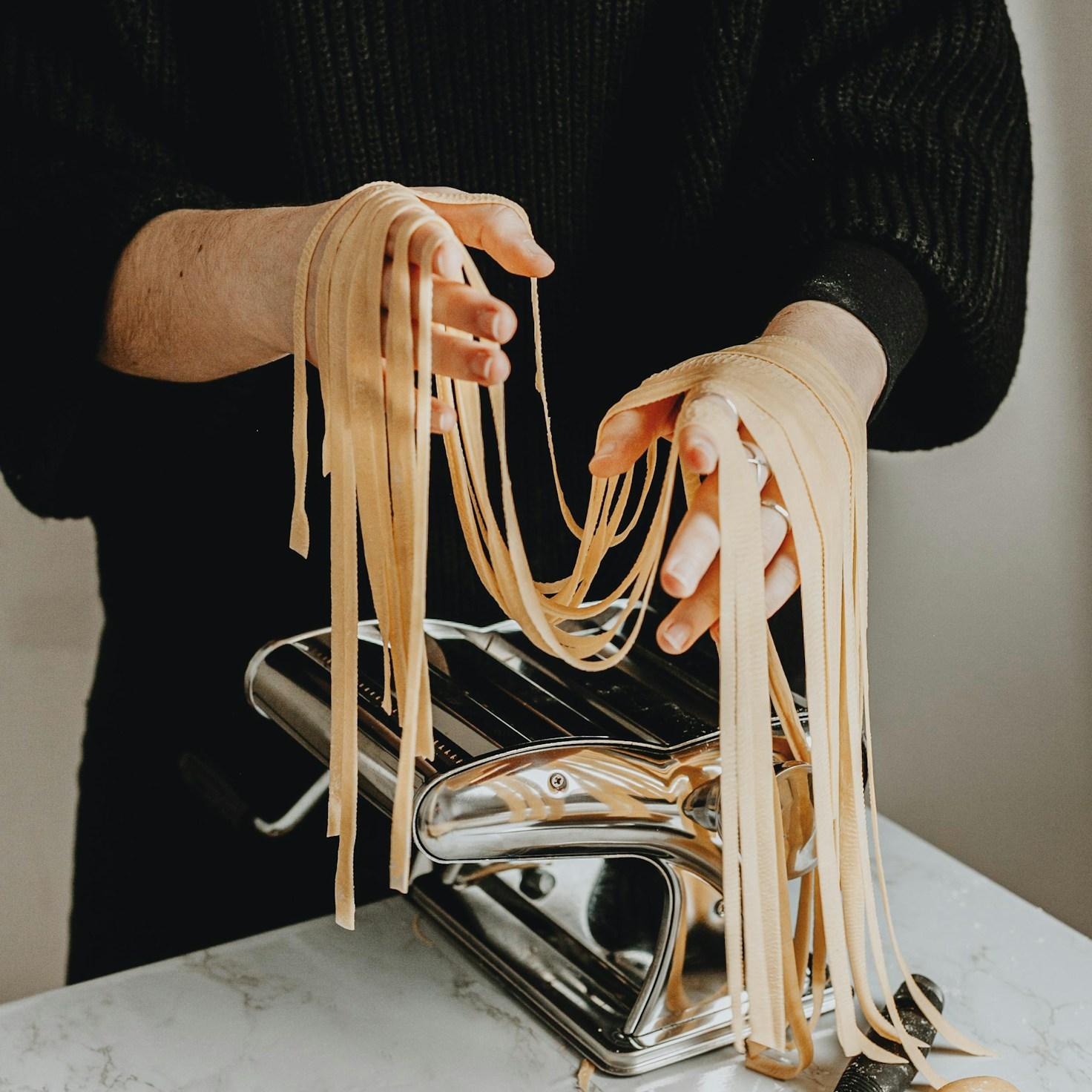 Community members collaborating in a modern cooking space, exchanging recipes and techniques